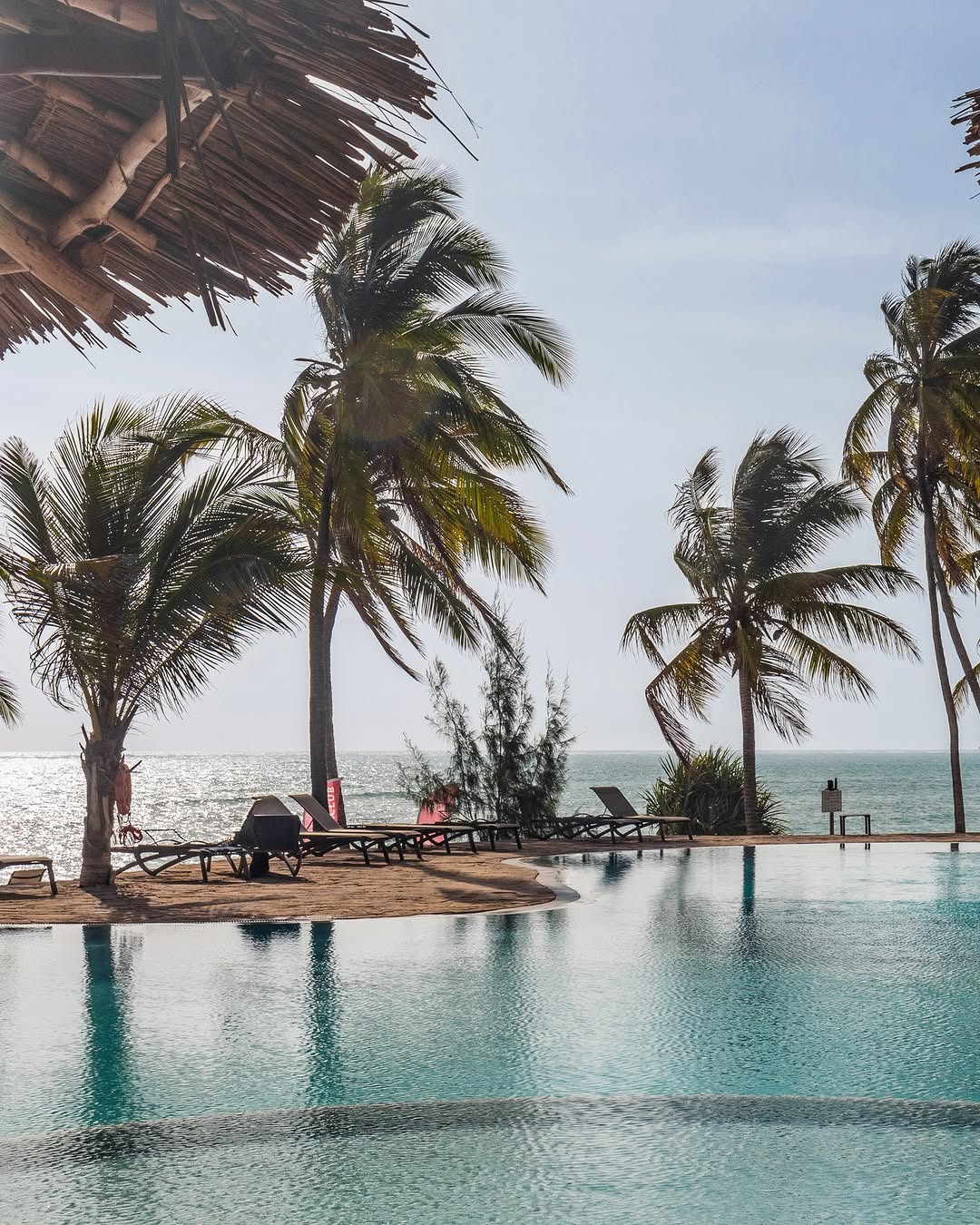 Where the pool meets the horizon
🏊 🌊 ☀️ 🍹 🤍
Slip into the water, look up, and let the blue stretch on forever. Afternoons don't get better than this.

Discover more. Link In Bio.

#karafuubeachresort #zanzibar #infinitypool #poolday #luxurytravel #islandvibes